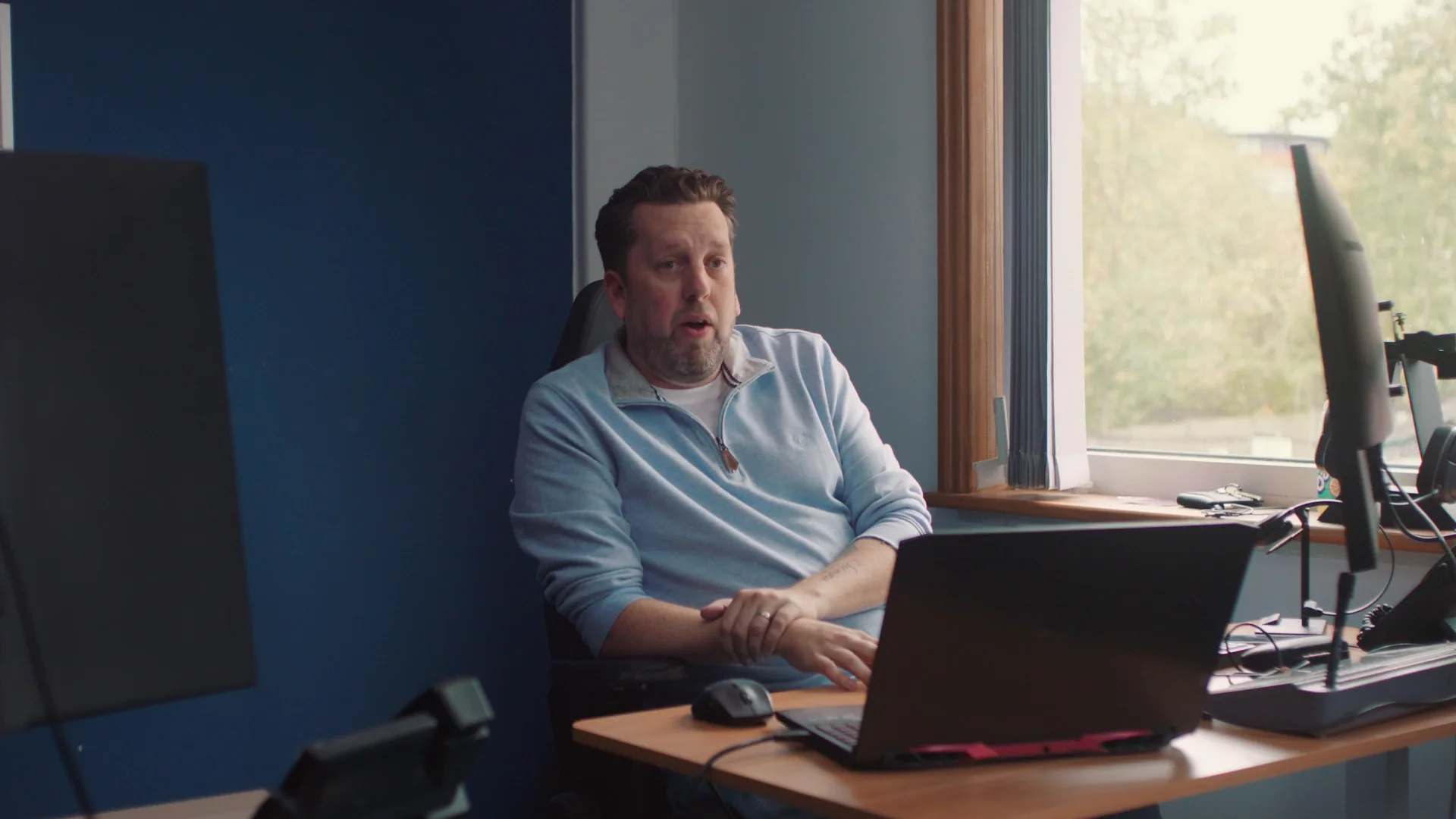 Dan Cockle working at his desk in the Cockle Finance office